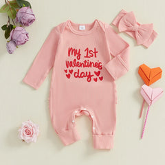 Baby girl Valentine’s jumpsuit with heart print and matching bow headband