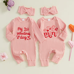 Baby girl Valentine’s jumpsuit with heart print and matching bow headband